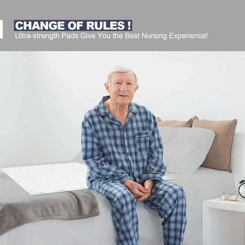 Heavy Duty Adult Underpads 40 By 60 Inches Hella Thick Disposable Bed Pads With Reinforced Cloth Backing Maximum Support Leak Proof Comfort 30 Count Discreet on bed next to elderly man in pajamas.