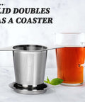 Extra Fine 18 8 Stainless Steel Tea Infuser Mesh Strainer With Large Capacity And Durable Double Handles next to a glass of tea