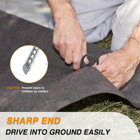 Hands using 8 Inch Rebar Garden Stakes Tough As Nails Ten Pack U Hook Metal Stakes Rust Proof Electrostatic Finish for ground cover.