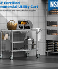 Beefy Heavy Duty 2 Tier Utility Cart On Wheels With Handle For Commercial Use NSF Certified Metal Rolling Cart For Warehouse Kitchen Garage And Serving Areas in a kitchen setting with utensils and appliances.