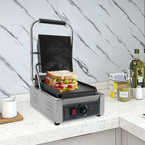 Heavy Duty Electric Panini Press Grill With 1800W Dual Heating Plates For Perfectly Grilled Steaks Hamburgers And Crispy Toasted Sandwiches on countertop with sandwich