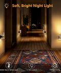 Straight Up Easy Dusk To Dawn Plug In Night Light With Smooth Slide Dimmer And Auto Sensor Zero Stress Setup For Hallway Bedroom Energy Saving LED Wall Lamp Top Shelf Two Pack installed in a hallway, emitting warm 3000K light.
