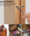 Two-pack copper hidden bracket hinge installed on wood cabinet door; close-up view.