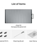 Front view: xTool P2 Honeycomb Panel 2.0 for P2/P2S laser engraver; honeycomb surface with handle; 4 pins and brush