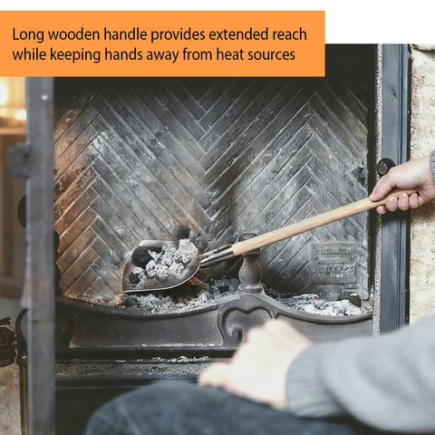 Using the Long Handled Iron Fireplace Shovel With Wood Handle Ash Scoop for fireplace cleanup, showing extended reach.