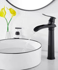 Matte Black Farmhouse Vessel Sink Faucet With One Hole, Tall Above Counter Waterfall Style, Single Handle next to white sink