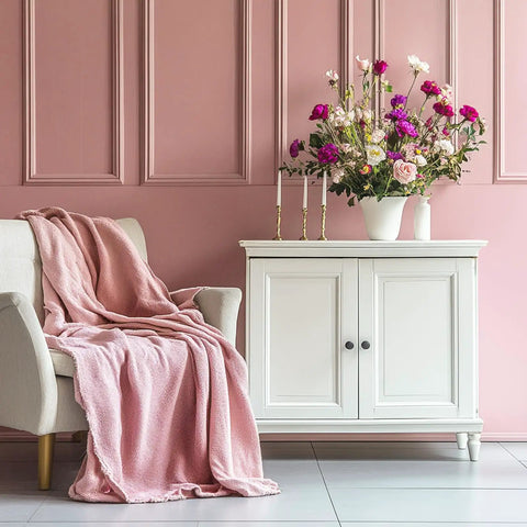 Upgrade Your Kitchen Game With These Swell Red Wooden Cabinet Knobs And Round Drawer Pulls Perfect For Dresser Furniture Makeovers And Top Notch Hardware Upgrades That Look Rad In Any Room, featuring a pink throw blanket on a sofa and flowers on a white cabinet.