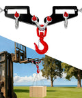 Heavy Duty Twin Forklift Lifting Hooks Featuring Bold Swivel Heads And Tight Mounting Bolts For Standard Tractor Or Garage Forks No Fuss Setup solidly lifting a box outdoors.