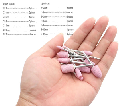 Hand holding Shank Mounted Grinding Stone Bits Set For Rotary Tools Pro Grade 70 Piece Abrasive Grinding Stones, pink alumina