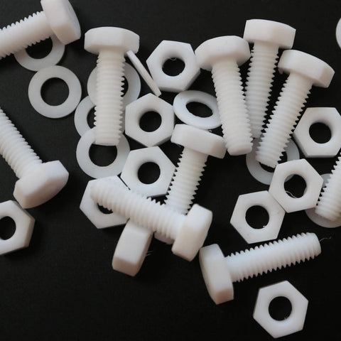 Top Shelf Natural PTFE Hex Head Bolts With Matching Nuts And Washers M6 X 20mm corrosion resistant plastic fasteners on black background.