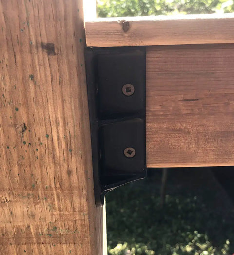 Beefy Sturdy 2x4 Railing Hangers for Wood Deck Railings Actual 1.5 x 3.5 black bracket attached to wooden deck support