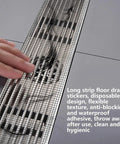 Hair Catcher for Shower-Self-Adhesive Drain Strainer Filter Roll applied on a floor drain with hair caught on it.