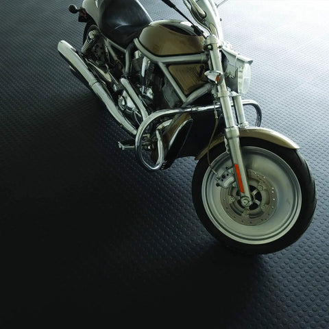 Motorcycle on black Interlocking 18x18 Inch Rubber Floor Tiles For Home Gym Garage Basement And Trade Show Flooring Raised Coin Pattern.