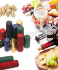Kickass 130 Piece Wine Bottle Cork And Heat Shrink Cap Kit With Genuine Cork Plugs And Vivid Pvc Foil Covers In Gold Black Red Green Blue For Serious Home Winemaking Projects with corks and colorful caps.
