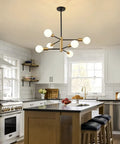 Dope Black And Gold 6 Light Sputnik Chandelier in modern white kitchen above island.