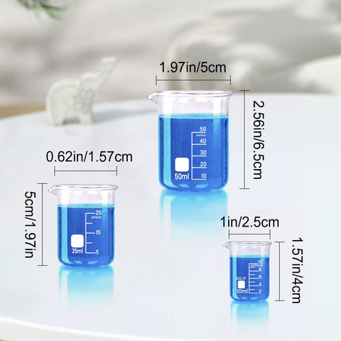 Go To Beaker Set With Five Sizes 10ml 25ml 50ml And 250ml Borosilicate Glass Lab Beakers Low Form on table with blue liquid