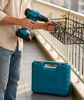 Man using Rock Solid 21V Cordless Drill And Electric Screwdriver With Quick Lithium Battery to install a planter box.