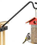 Heavy Duty Deck Hook Railing Bird Feeder Hanger With Rustproof Coating For Flower Baskets And Outdoor Patio Decor Built Like A Tank With Zero Drill Install Holds Twenty Two Pounds No Sweat Setup with bird at feeder.