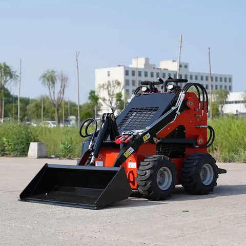 Compact Skid Steer Loader With Quick Tach System For Pavement Repair Debris Removal And Barn Cleaning shown in outdoor setting