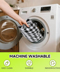 Person placing black and white checkered Waterproof 6 Foot Table Cover With Bench Covers into washing machine for cleaning.