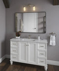 Two Light Wall Sconce In Vibrant Brushed Nickel From The Artifacts Collection above a mirrored bathroom vanity