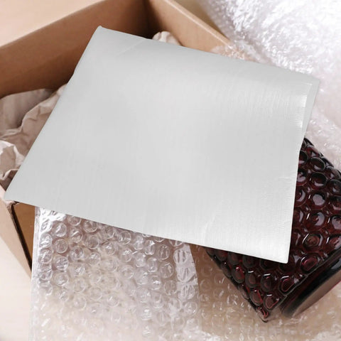 100 Pack White EPE Bubble Foam Pouches for Shipping Fragile Glassware in a cardboard box, showing reinforced seams and cushioning