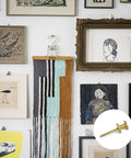 Heavy Duty Double Headed Picture Hangers And Thumb Tacks Pack Of Fifty Pieces For Hassle Free Wall Mounting With A Rock Solid Grip, shown with framed artwork.