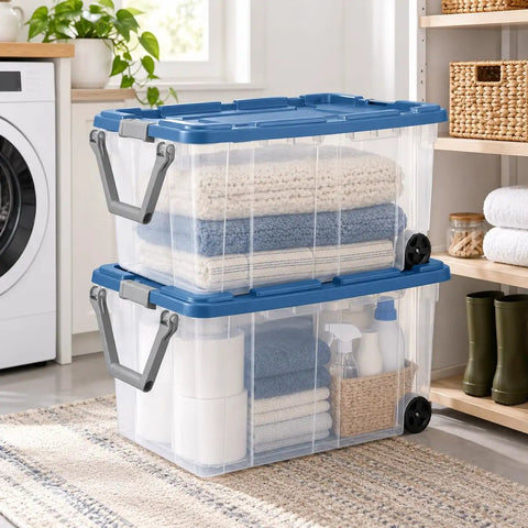 Premium Heavy Duty Wheeled Storage Bins 160 Quart 2 Pack with clear boxes holding towels in a laundry room.