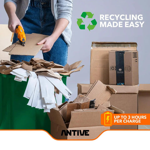 User cutting cardboard with Slick Cordless Electric Fabric Scissors And Heavy Duty Cardboard Cutter With Two Swappable Blades.