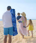 Family walking on beach with Beach Cabana Canopy 6.5 Feet By 6.5 Feet, Easy Set Up And Take Down, Portable Sun Shade carrying bag