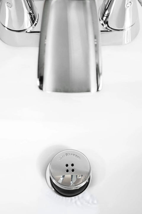 The Real Deal Drain Protector And Hair Catcher Combo For Bathtubs And Sinks Chrome Finish visible over sink faucet area.