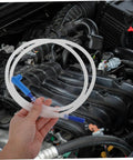 Flexible Brake Bleeder Hose 47 Inch Clear Tubing for Brake Fluid shown in a hand near vehicle engine.