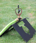 Real Deal Rooftop Sprinkler Offering 360 Degree Rotating Spray Pattern For Lawn And Garden Irrigation with green hose connection.