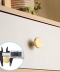 Brushed Brass Cabinet Knobs Set Of 8 With Screws And Screwdriver 20X25 Mm Solid Brass Hardware shown on wood drawer with caliper