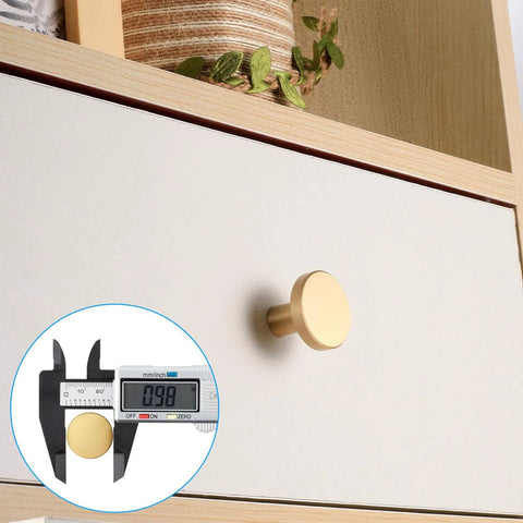 Brushed Brass Cabinet Knobs Set Of 8 With Screws And Screwdriver 20X25 Mm Solid Brass Hardware shown on wood drawer with caliper