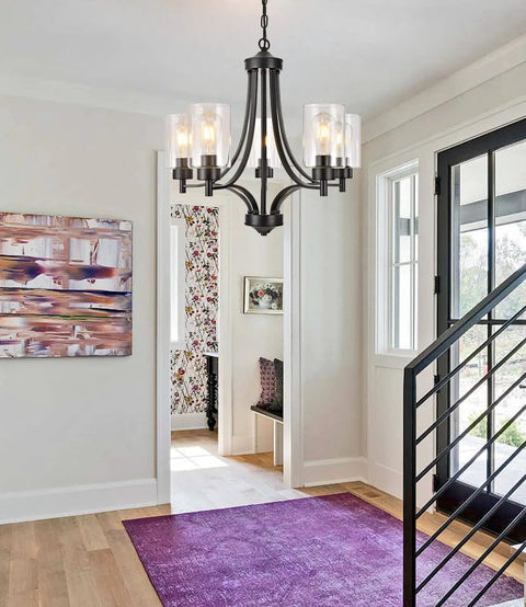 Contemporary Black 5 Light Glass Chandelier For Dining Room And Kitchen Island Farmhouse Style Ceiling Pendant Light with clear glass shades in a modern entryway.