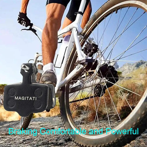 Cyclist on mountain trail with close-up of Four Pairs Semi Metallic Disc Brake Pads For Bikes Ready To Stop On A Dime, Compatible With Avid Elixir 1 3 5 7 9 R ER CR Mag Level TL T Sram XX X7 X9 XXWC DB1 DB3 DB5 And Other Sram Models.