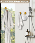 Suction Cup Hooks For Shower And Kitchen No Drill Mounting Brushed Gold Finish holding robe and towel in bathroom