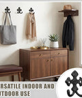 Built Like A Tank 8 Pack Double Wall Hooks Heavy Duty Wrought Iron Cast Iron Vintage Hangers decorative coat and towel holder in home setting.