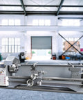Premium Benchtop Metal Lathe With A Beefy 750W Brushless Motor And Cruising 0 To 2500 RPM variable speed showcased in a large workshop.