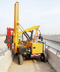 Pile Driver Machine For Guardrail Posts And Roadside Installations Portable Post Driver in use on highway