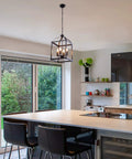 Industrial Pendant Light With Classic Black Metal Cage For Farmhouse And Modern Homes, hanging in a modern kitchen space