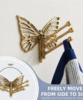 Knockout Brass Butterfly Swivel Hook Foldable Tri Arm Gold Finish Coat Rack with a towel hanging, 180° motion for easy access.