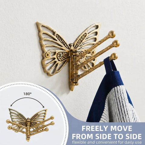 Knockout Brass Butterfly Swivel Hook Foldable Tri Arm Gold Finish Coat Rack with a towel hanging, 180° motion for easy access.
