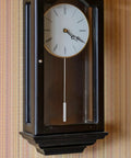 DIY Clock Pendulum Replacement Cylinder for Wall Clocks 10.62 Inch Metal Pendulum shown in use in a wooden wall clock