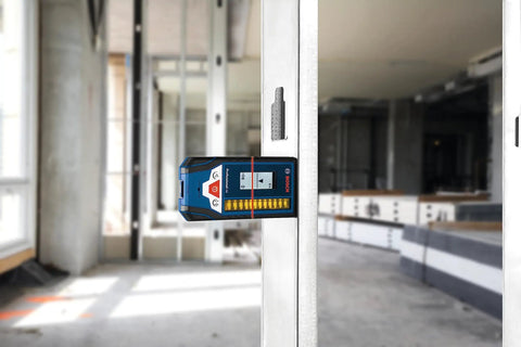 LR8 165 Ft Red And Green Beam Line Laser Receiver with Mounting Bracket on door frame, showing Bosch logo and digital display.