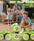 Family playing with Rad Stunt RC Car With Two Point Four GHz Remote 360 Degree Flips Double Sided Crawler USB C outdoors