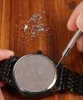 Hands using tool with 100 Piece Watch Screw Set With Micro Battery Clamp Screws, Stainless Steel Assortment For Watchmaking And Repair