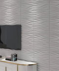 Wavy White PVC Wall Panels Pack Of 12, 19.7x19.7 Inches, Lightweight And Fire Resistant, mounted in living room behind TV and cabinet