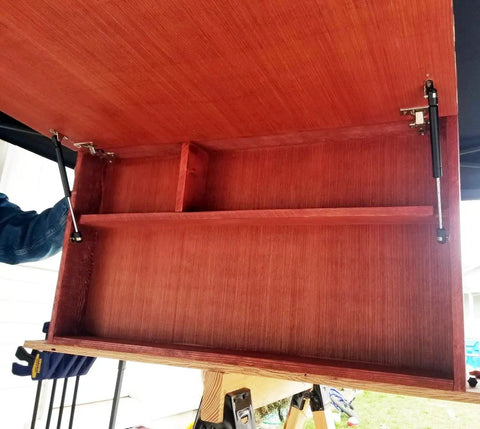 Open wooden cabinet with 100N 22.5lb gas struts 10 inch lift supports set of 4 for lids and doors, smooth 90 degree opening.